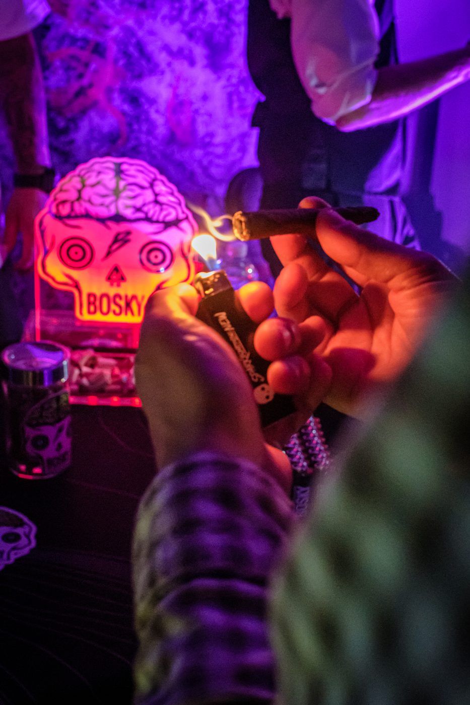 Jar under a neon skull sign